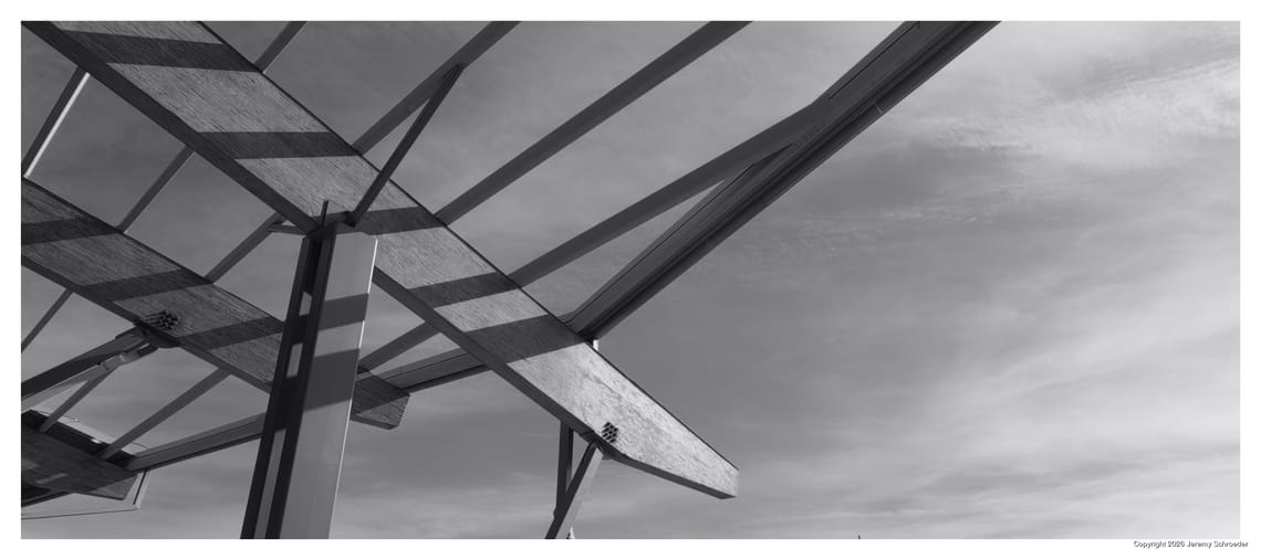 Steel ribs against a pale sky