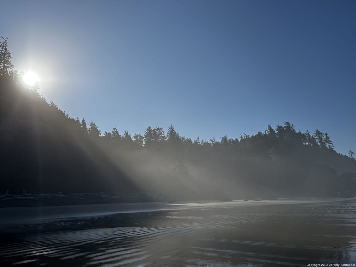 Sunbeams Cutting Through the Shoreline Mist
